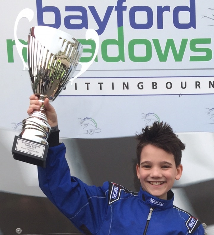 Harvey Roffe lifts the trophy for M2 Computing